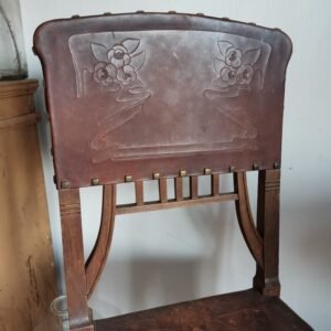 Unique set of leather tooled chairs with brass studs. Spanish medieval style